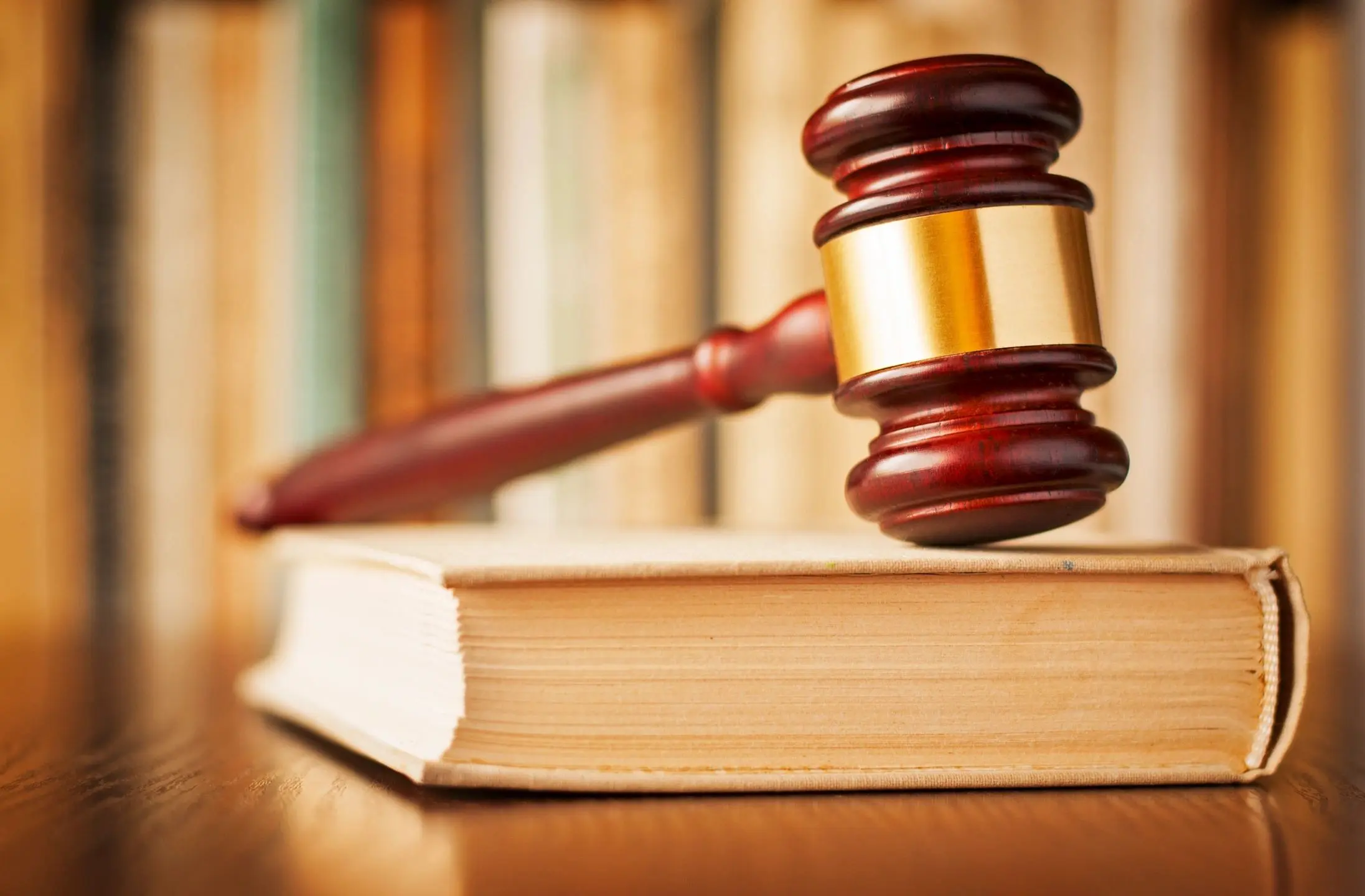 Courtroom gavel resting on book