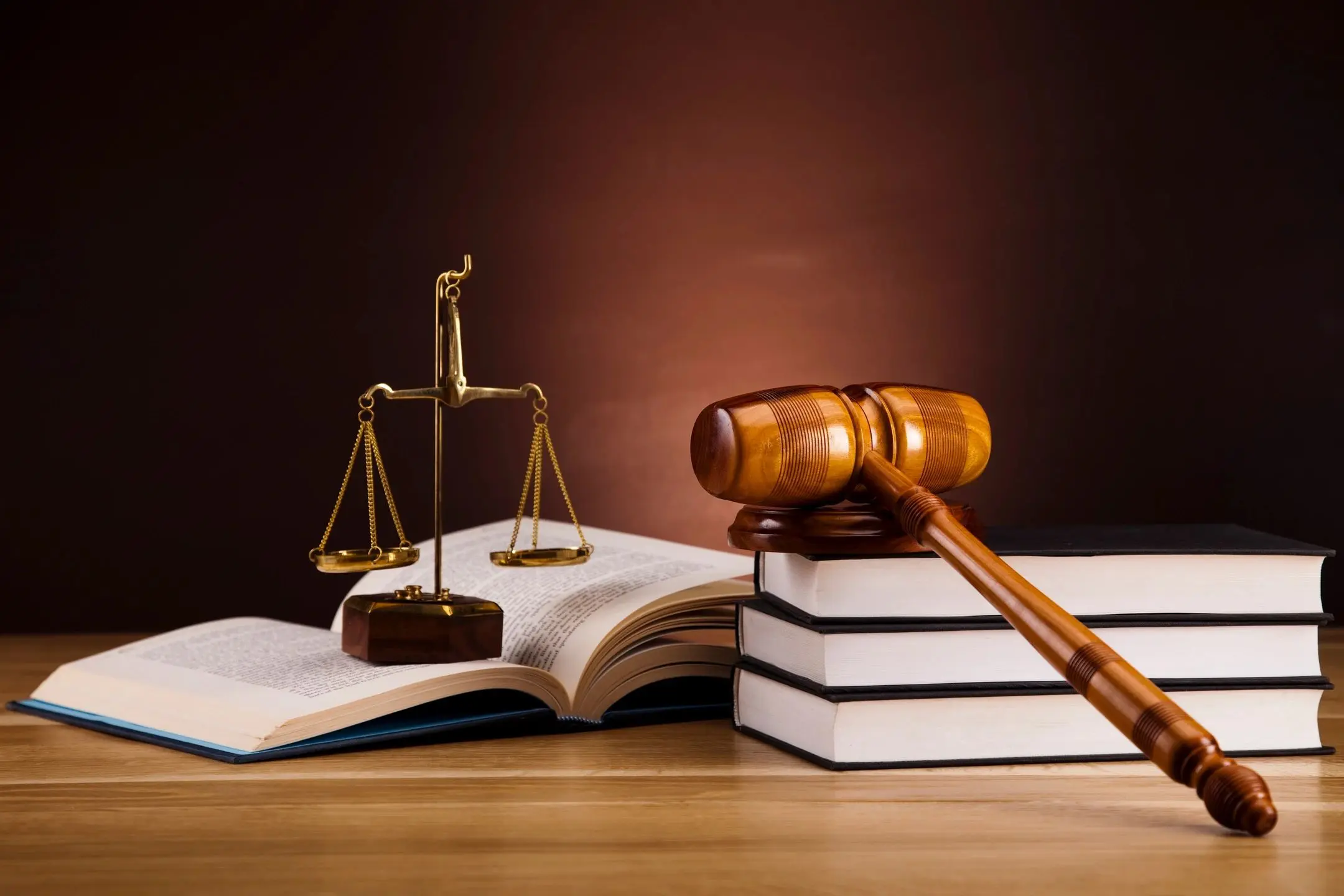 Legal books with gavel and scales