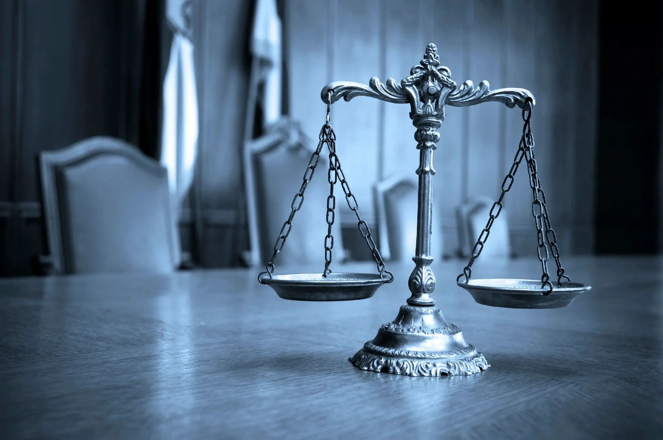 Balance scales on wooden table